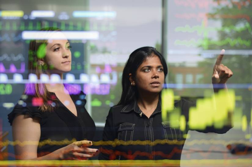 A computer algorithm developed by Johns Hopkins researchers combines 27 factors to assess patient risk to aid in early detection of life-threatening sepsis (Katharine Henry (left) and Suchi Saria pictured)